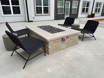 Outdoor fire pit lounge with modern seating